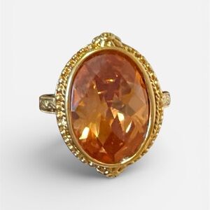 Radiant Gold Ring with Orange Gemstone